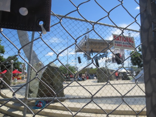 Peering through the fence at the Made In Detroit stage